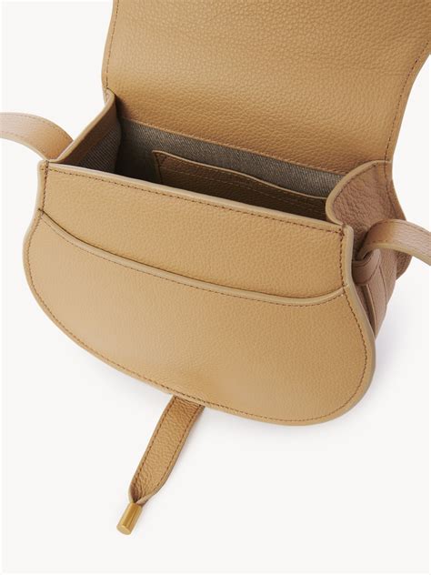 Small Marcie saddle bag in grained leather 